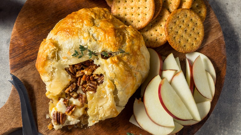 baked brie in pastry with apples and crackers