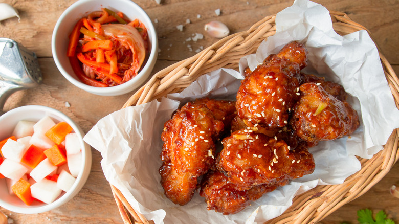basket of fried chicken next to kimchi