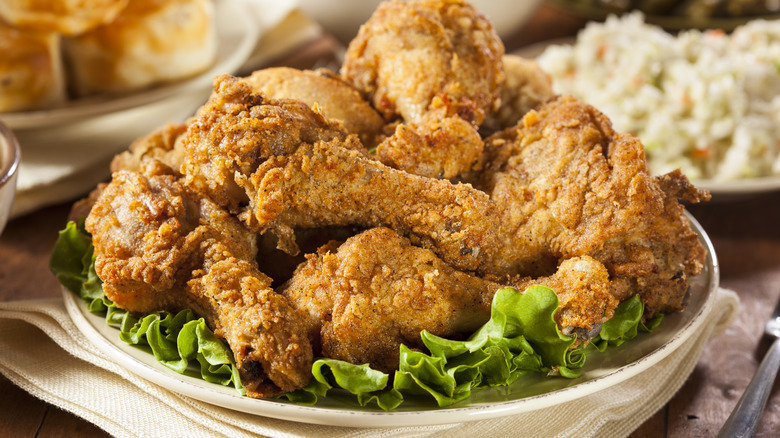 fried chicken sitting on bed of lettuce
