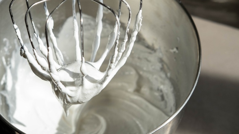 Person whipping cream by hand