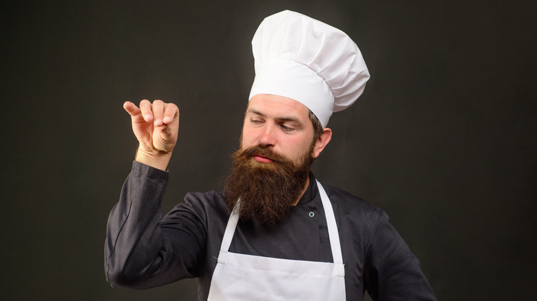 Bearded chef with hat and apron 