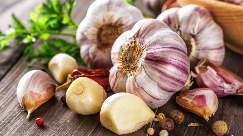 Garlic bulbs and cloves on a wooden table