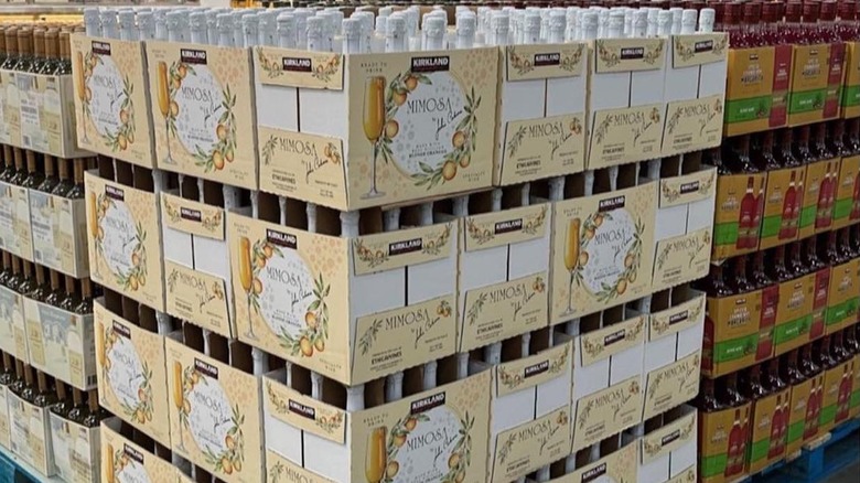 Cases of Kirkland bottled mimosas stacked in Costco