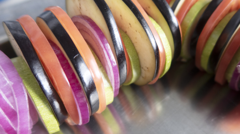 perfectly sliced vegetables arranged alternately