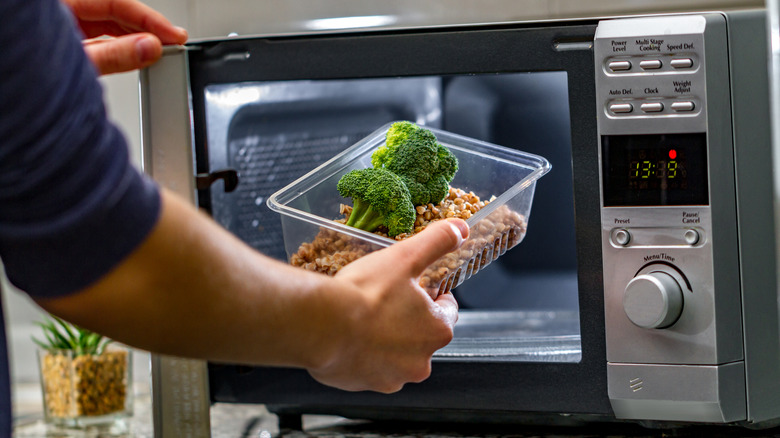 placing food container into microwave