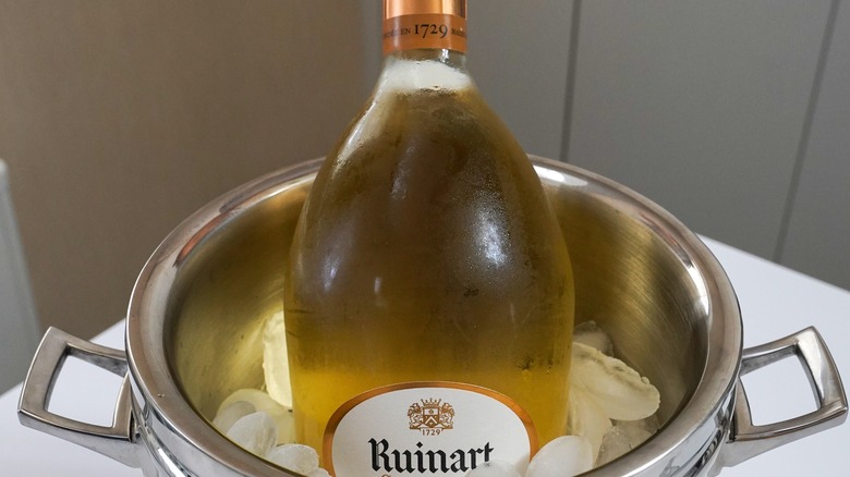 Sparkling wine bottle on ice