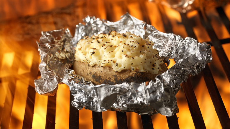 grilled potato in foil on grill