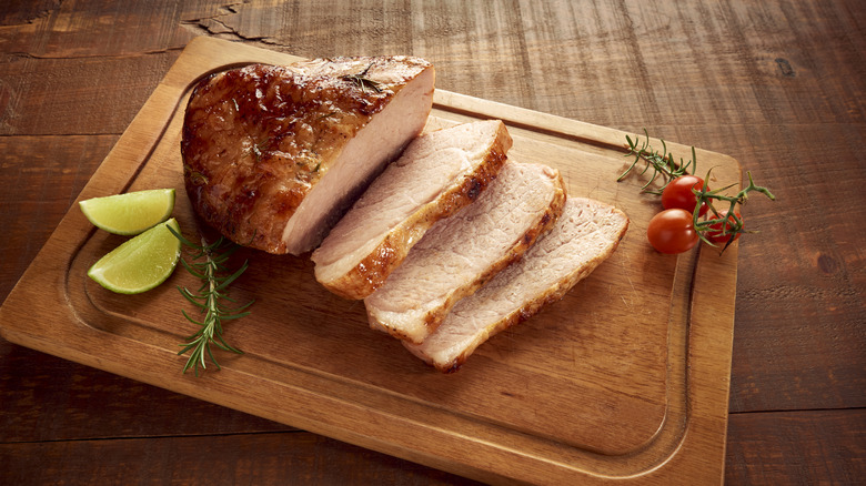 Roasted pork being cut