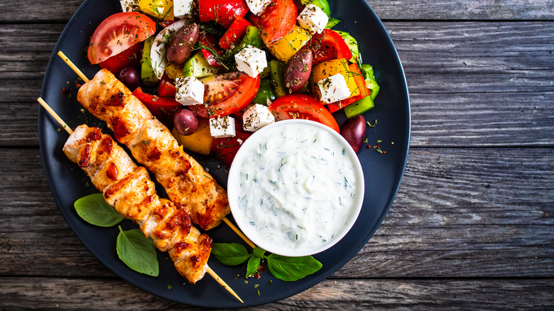chicken skewers with Greek salad