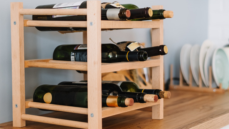 Wine bottles on a rack in the kitchen