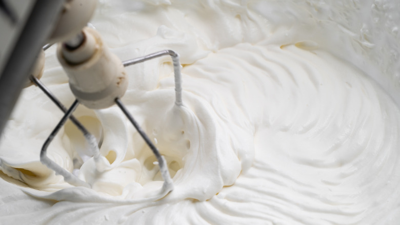 Whipped cream in mixing bowl