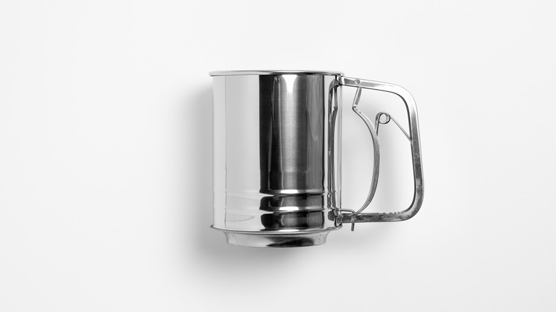 metal sifter on a white background