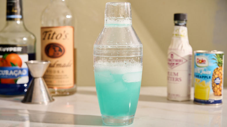 cocktail shaker filled with shaken drink