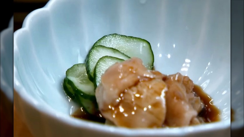 bowl with cucumbers and sea squirt in soy sauce