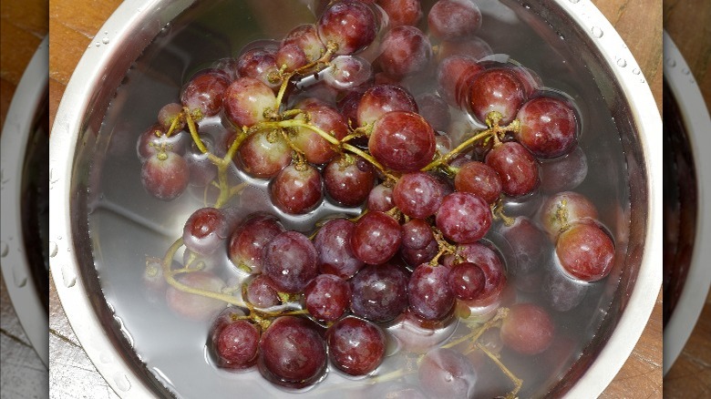 red grapes soaking in clear liquid