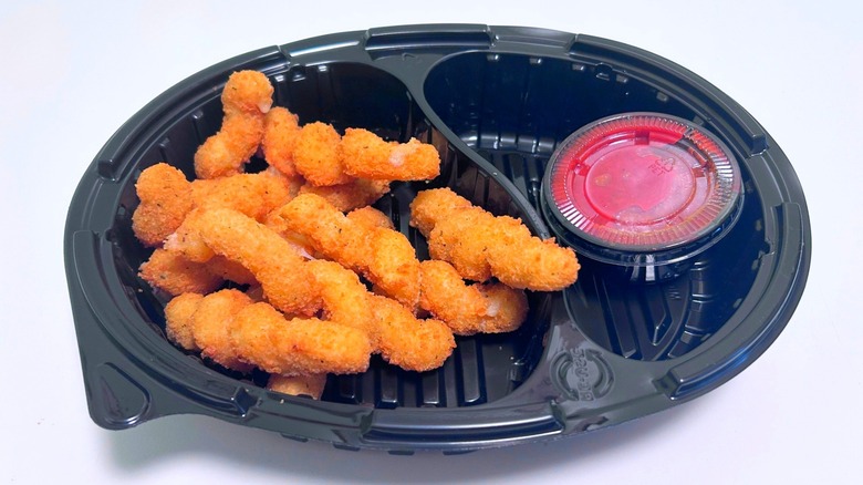 Red Robin's mozzarella twists with tub of marinara sauce