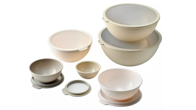 Various beige bowls and lids from the Cook With Color Mixing Bowl Set
