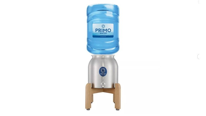 A Primo Stainless Steel Crock with jug of water