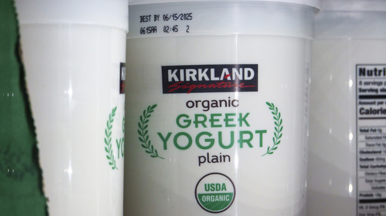 Three tubs of Kirkland Greek Yogurt on the shelf in store