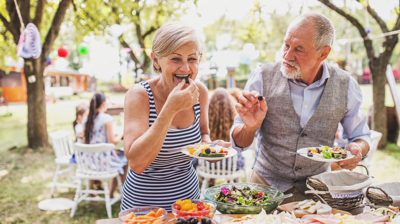 Woman eating over buffet