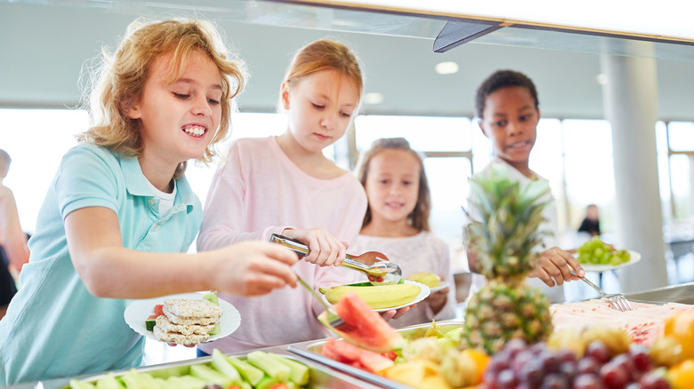 children at fruit buffet