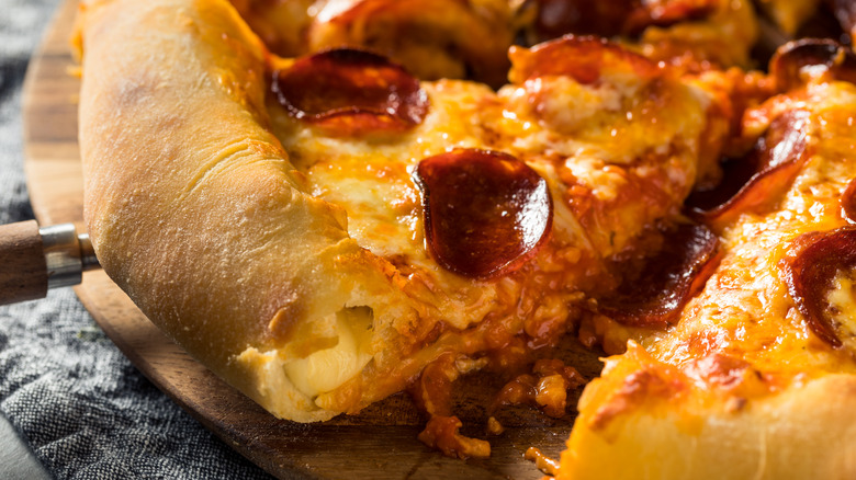 Stuffed pizza on a board