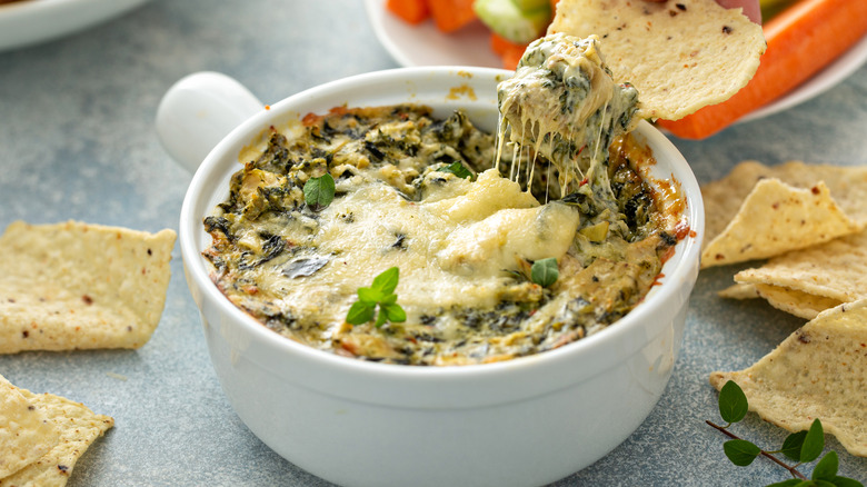 Bowl of spinach dip with tortilla chips