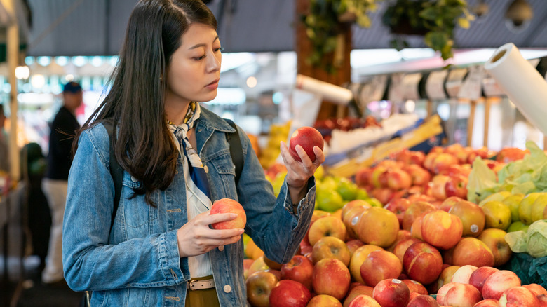 buying peaches in the store