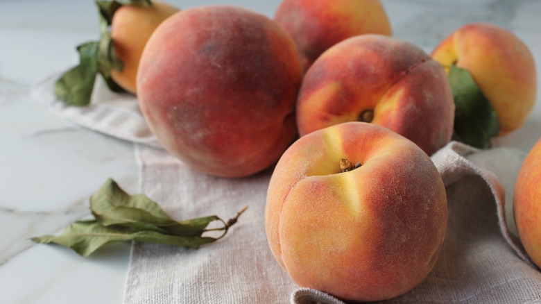 peaches on a marble counter