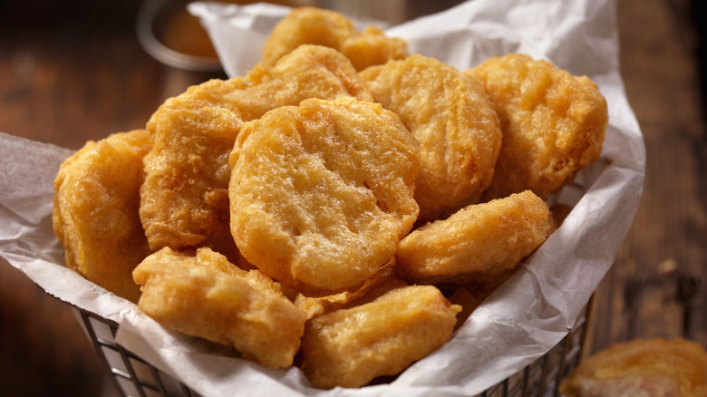 Nuggets in a basket with parchment paper