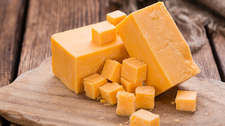 Cheddar cheese cubes and block