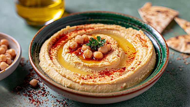 bowl of hummus with paprika on top