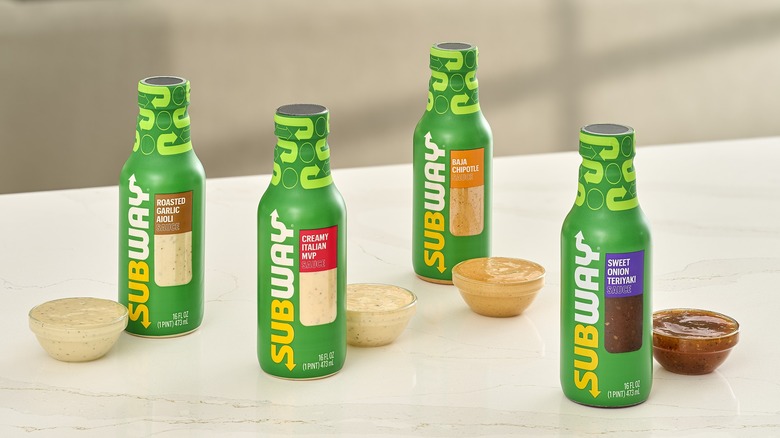 four subway sauces green bottles