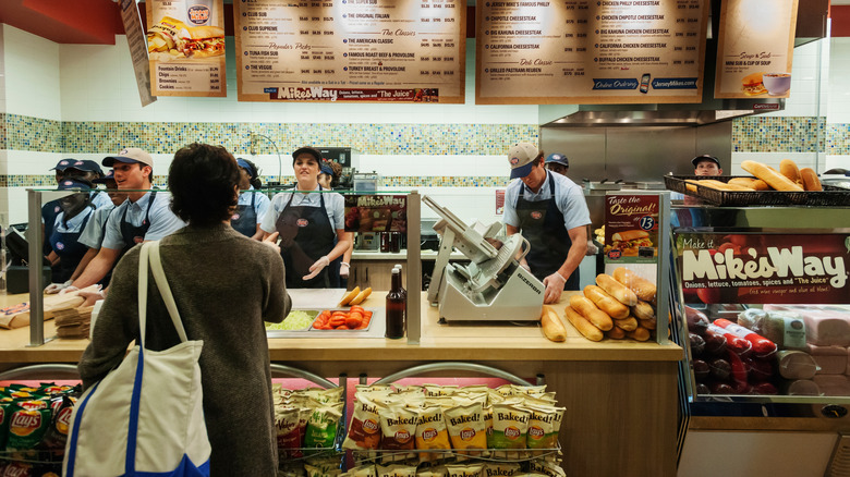 A customer ordering food from a Jersey Mike's