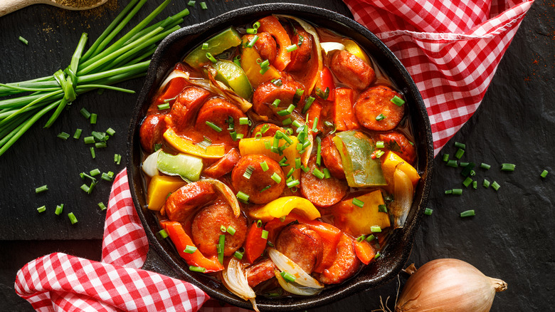 Sausage and tomatoes in cast iron 