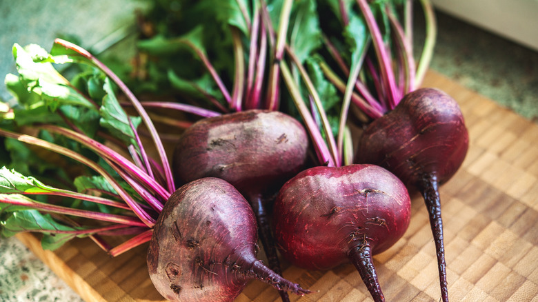 Raw beets on cutting board