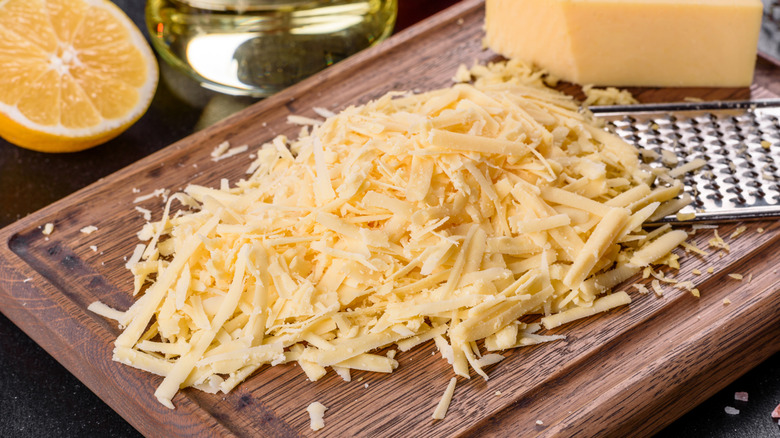 Grated cheese on a wooden block
