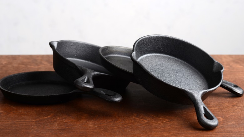 Four cast iron skillets
