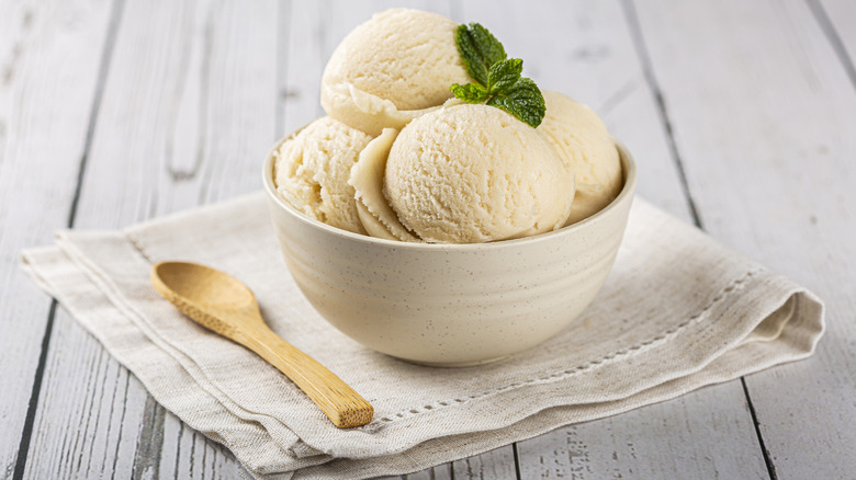 Bowl of generic vanilla ice cream with spoon