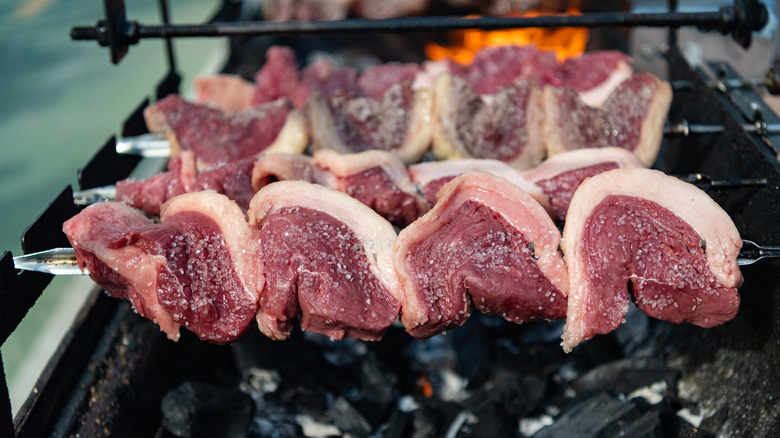 Picanha roasted over hot coals.