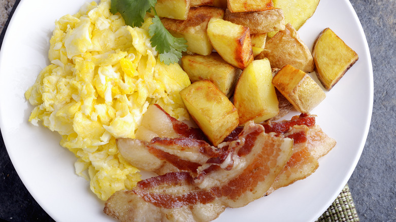 Eggs, breakfast potatoes, and bacon