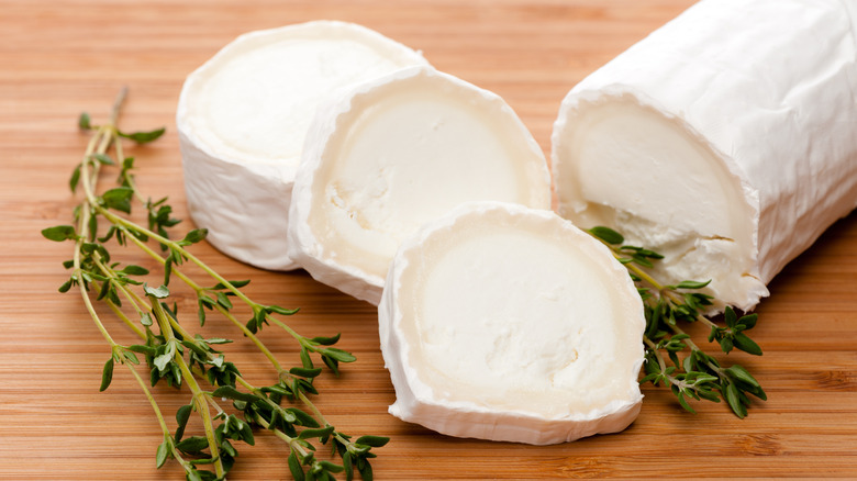 Sliced goat cheese with fresh thyme