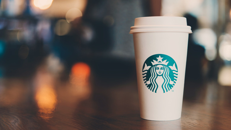 Starbucks coffee cup on handoff bar