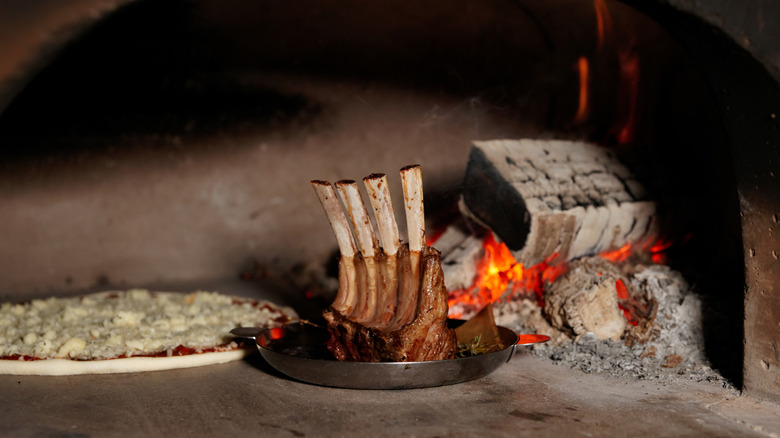 rack of lamb in brick pizza oven