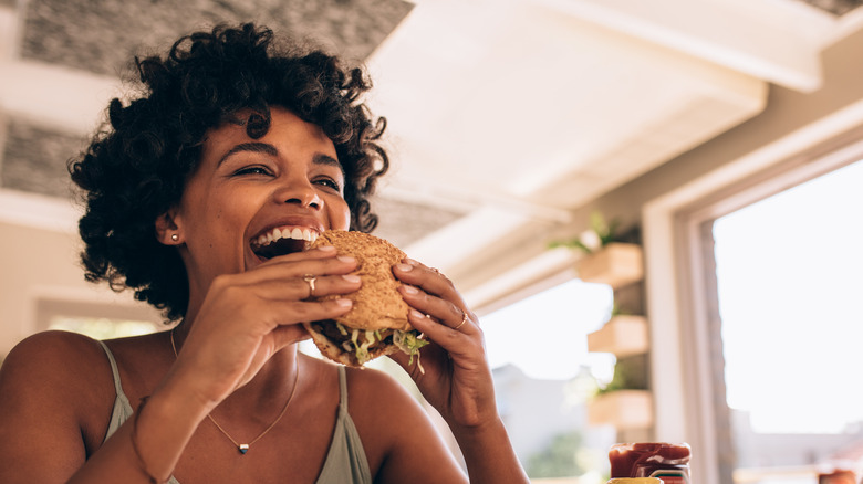 Woman eating a burger