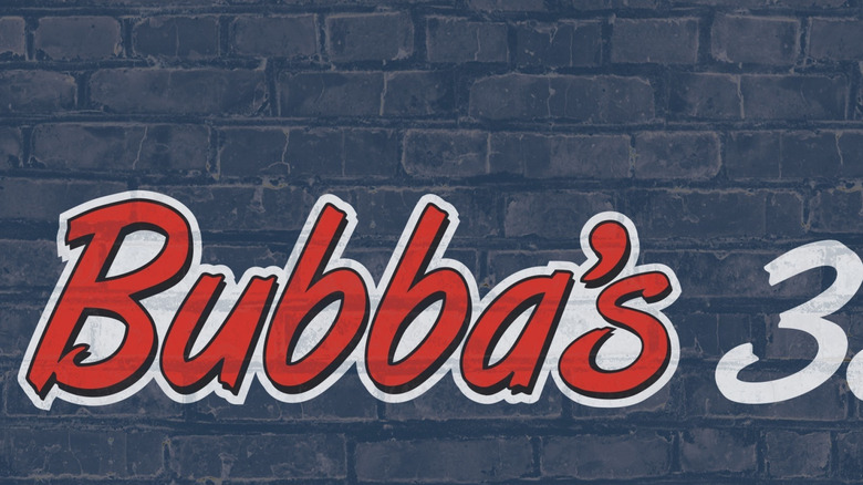 The Bubba's 33 logo printed over a brick wall