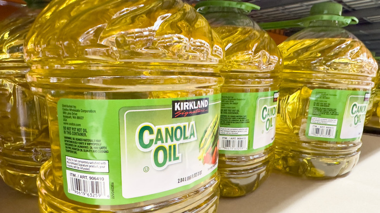 a shelf of 2.84-liter jugs of canola oil at Costco