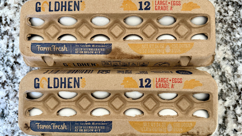 two cartons of Aldi Goldhen-brand eggs on a countertop