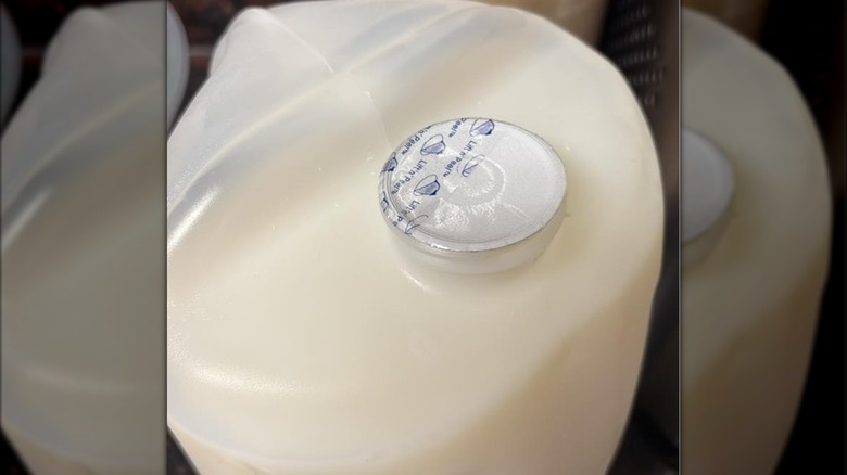 Close-up of seal under the lid of Kirkland Signature milk jug