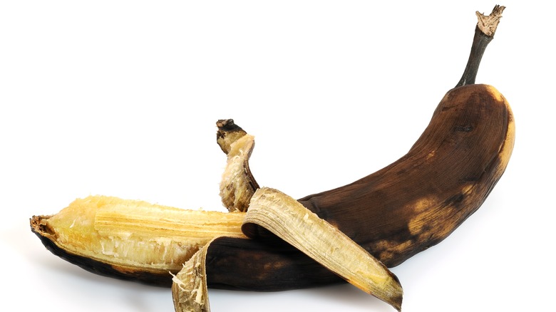  half-peeled overripe banana